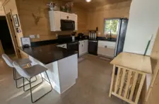 Spacious open-concept kitchen and dining area at Smile Awhile, perfect for family gatherings in the Northwoods.