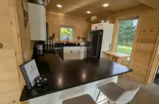 Modern, fully equipped kitchen at Smile Awhile in Eagle River, WI, featuring stainless steel appliances and ample counter space.