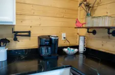 High-end kitchen appliances including stove, microwave, and large refrigerator at our Eagle River vacation rental.
