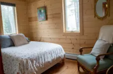 Wake up to nature: bedroom at Smile Awhile with direct views of the Wisconsin Northwoods.