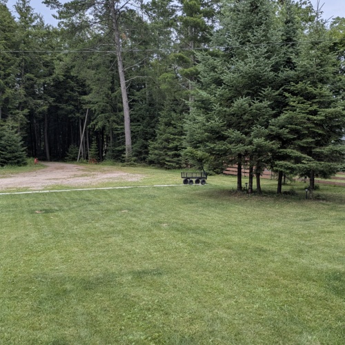 Ample free parking on premises at Smile Awhile in Eagle River, WI, with plenty of room for boat trailers, snowmobile haulers, and multiple vehicles.
