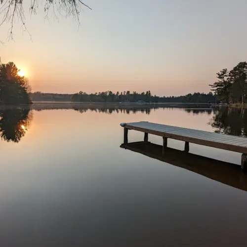 Serene outdoor patio area overlooking the lake in Eagle River, WI.