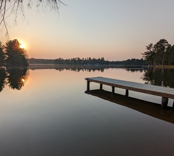 Securely fenced property at our lakefront rental, providing a safe and private environment for kids to play and guests to relax in nature.