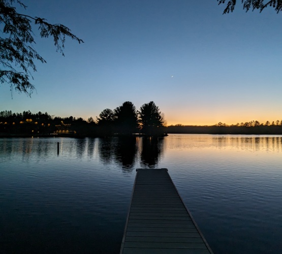 Securely fenced property at our lakefront rental, providing a safe and private environment for kids to play and guests to relax in nature.
